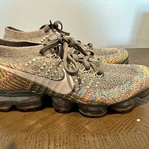 Nike gray running shoes. Lots of colors in them.